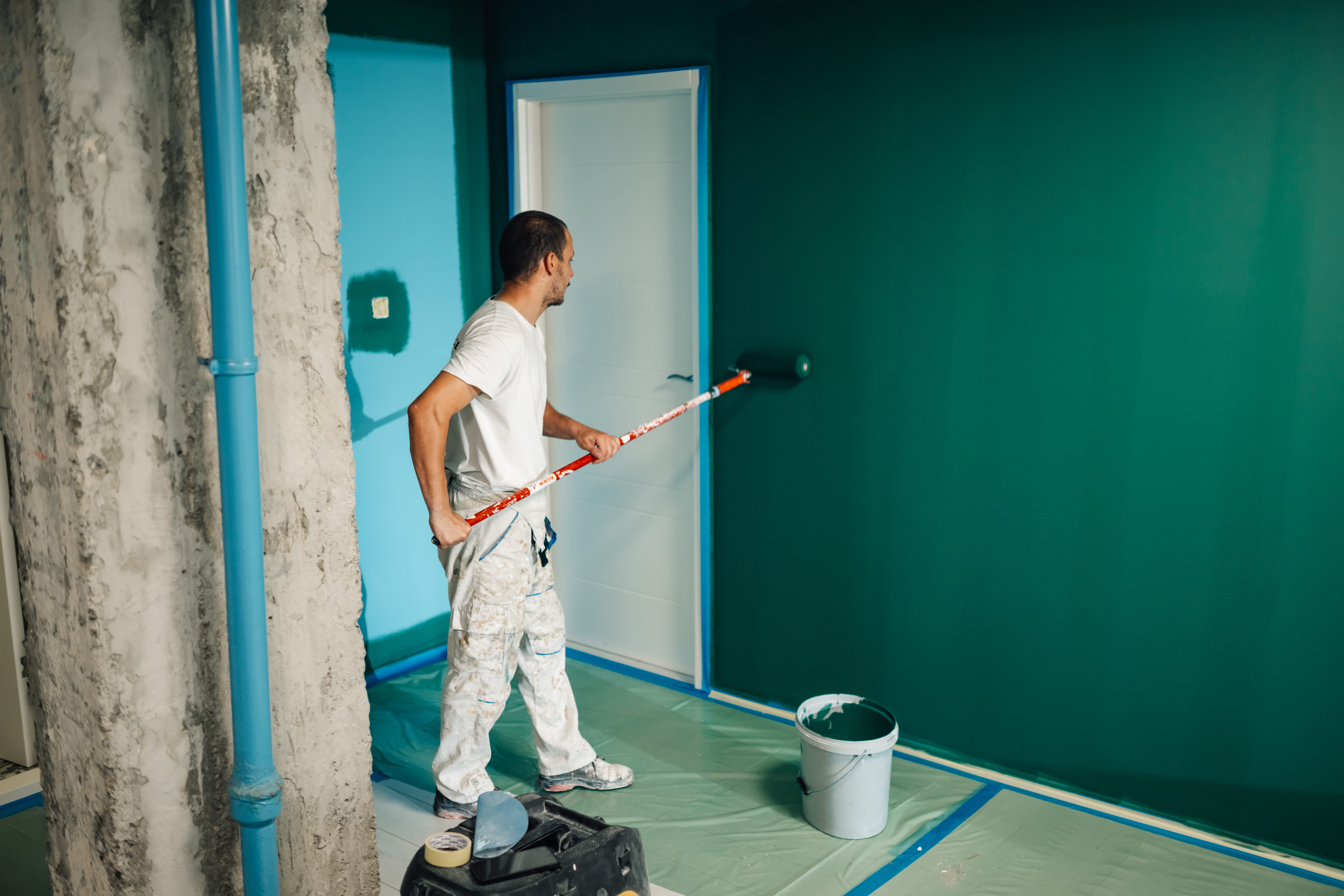 Feature wall being painted green