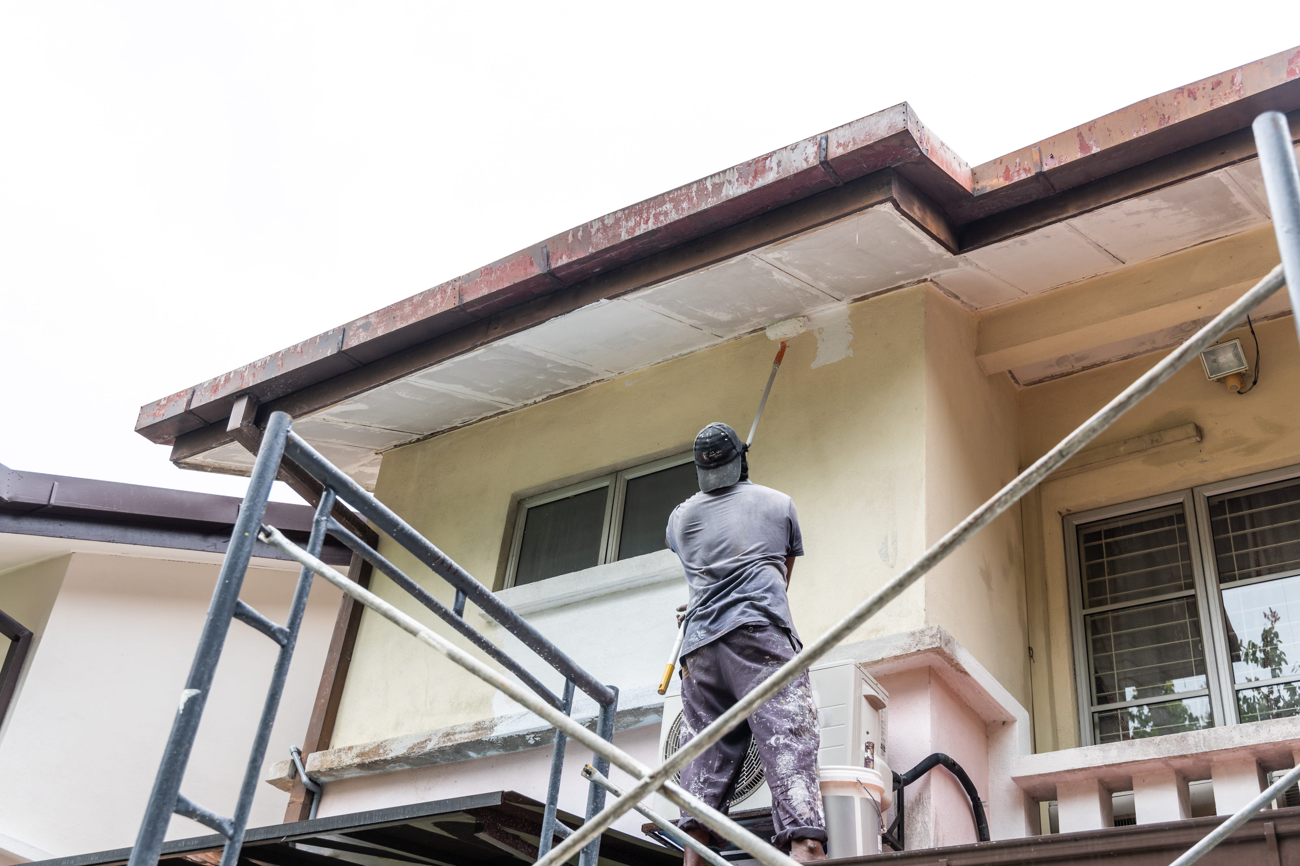 Roof undercoat being applied